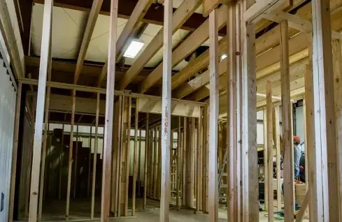 Interior wood-stud partition framing inside a commercial building, photographed by Trade Pro Construction
